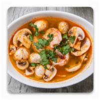 Tom Yum Goong · Shrimp, mushroom and tomato in a spicy lemongrass broth.