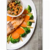 Grilled Salmon · Steamed of baby corn, carrot and broccoli with your choice of panang sauce, peanut sauce or ...