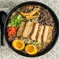 Kumamoto Danji Ramen · Pork bone soup with mayu oil (dark roasted leek with crushed garlic oil), topped with roaste...