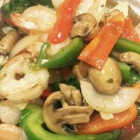 Spicy Basil · Popular spicy stir-fry with garlic and chili with basil, mushroom and bell pepper.