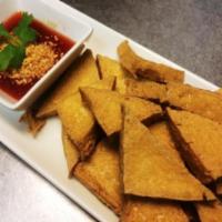 Deep-Fried Tofu · Firm tofu deep fried to a golden brown, served with sweet and sour sauce and ground peanut. ​