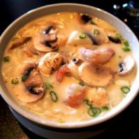 Tom Kha · Fresh spice and herb in light coconut milk soup base with white mushrooms, yellow onion, gre...