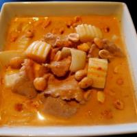 Massaman Curry · Potatoes, yellow onion and peanuts in coconut soup base with massaman curry sauce. Served wi...