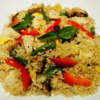 Spicy Green Fried Rice · Red bell peppers, egg, sweet basil leaves, green beans, and white mushroom in special made g...