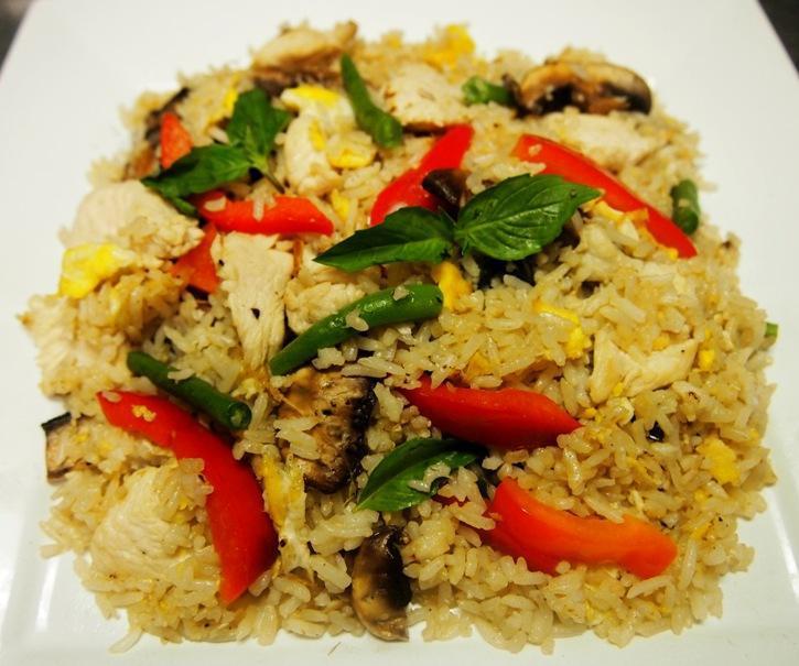 Spicy Green Fried Rice · Red bell peppers, egg, sweet basil leaves, green beans, and white mushroom in special made green curry sauce.