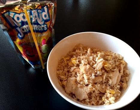 Kids Chicken Fried Rice · Rice stir-fried with chicken and egg. For children under 12 years old, served with a Kool-Aids drink.