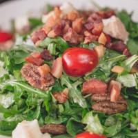 Wild Arugula Salad · Balsamic reduction, imported Gorgonzola, cherry tomatoes, candied pecans, warm pancetta and ...