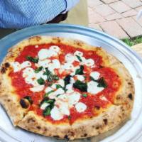 Margherita Pizza · Tomato sauce, fresh mozzarella and basil.