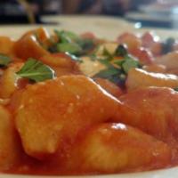 Gnocchi al Telefono · Homemade potato pasta with tomato sauce, diced fresh mozzarella and basil.