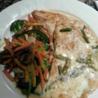 Pollo Monte Carlo · Chicken breast sauteed with shallots, asparagus and melted mozzarella in a champagne sauce.