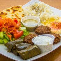 #18 Vegetarian Mix · Pita, hummus, falafel, rice, salad and grape leaves.
