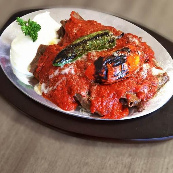 #19 Iskender Kebab · we cook bread with butter and add home made gyro( in Turkish we call Doner ). We add tomato based iskender sauce and add melted butter on top of all. On the side we are serving with yogurt.
