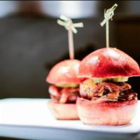 Cab Angus Sliders 3(PCS) · Guinness caramelized onion, American cheese, mayo and pickle served on mini brioche.