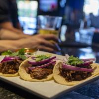 Street Tacos · Choice of one: Carne Asada, Carnitas, or Chicken with pickled red onion, cilantro.

Served w...