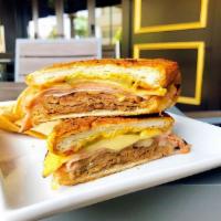 Cubano Sandwich · Pulled pork, black forest ham, swiss, pickles, mustard on pressed french roll.