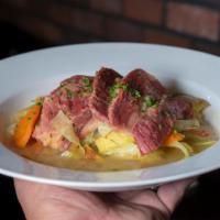 Corned Beef and Cabbage · Corned beef, roasted potatoes, onions, carrots and celery.
