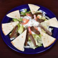 Coney Gyro Salad · Carved off the spit with lettuce, tomatoes, onions and homemade tzatziki sauce.