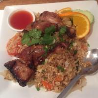 Djan's Fried Rice · Grilled marinated chicken BBQ over fried rice with egg, onions, carrots, green onions and to...