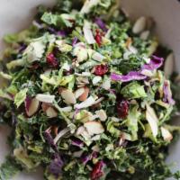 Raw Kale & Brussel Sprout Salad · Kale, Brussel Sprouts, Shaved Parmesan, Almonds, Cabbage, Cherry Tomatoes, Cranberries, Tahi...