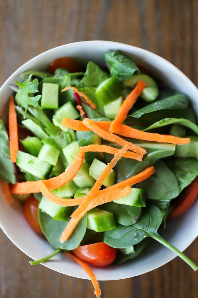 Mixed Green Salad · Served with tomatoes, cucumbers,  shredded carrots and our house vinaigrette dressing. Vegetarian. Gluten-free.
