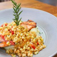 Grilled Salmon Plate · Sustainable. Grilled salmon, creamed corn, red bell Cajun sauce, Yukon russet mashed potatoe...
