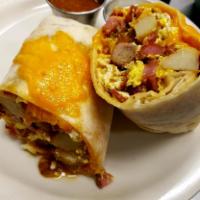 Breakfast Burrito · Bacon, Sausage, Chouriço (Portuguese sausage), Potatoes, Eggs and Cheese, served with house ...