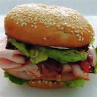 Turkey Club Sandwich · Lettuce, tomato, red onion, white turkey, bacon and avocado.