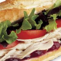 Turkey Sandwich · Hand sliced all natural oven roasted turkey, provolone, cranberry sauce, mixed greens, roma ...