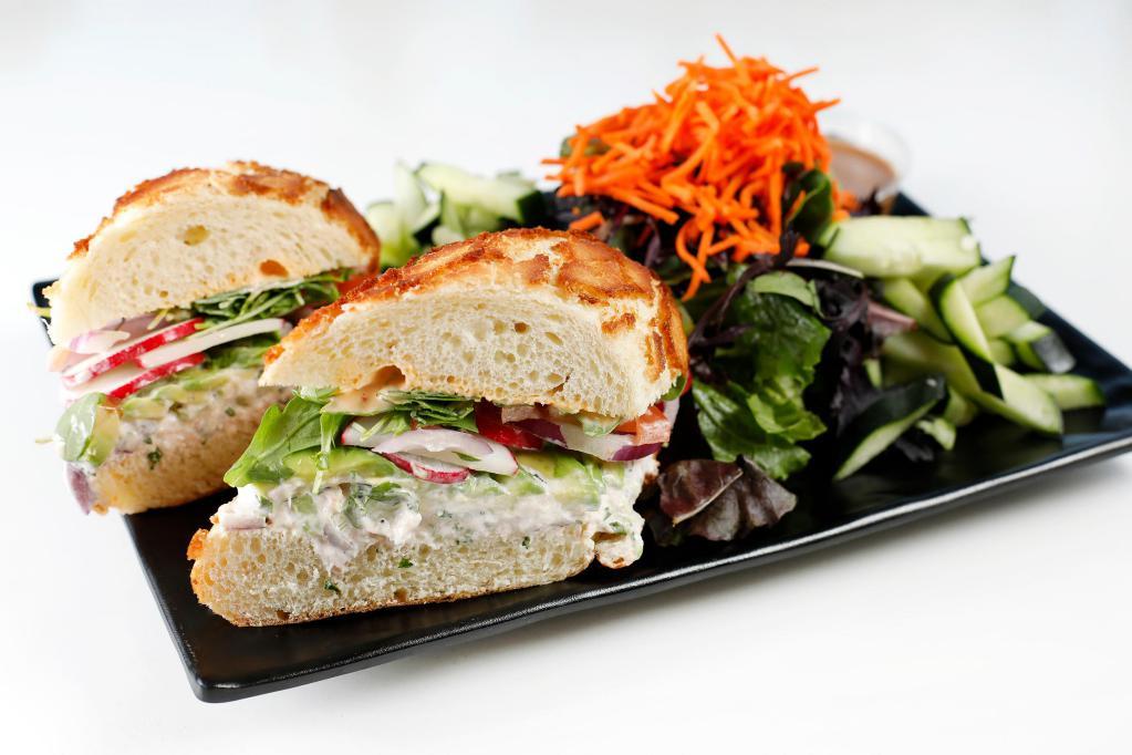 Crab Sandwich · Fresh Dutch Crunch Roll with Homemade Crab Salad, Radish, Onion, Tomato, Avocado, Chili Mayo, Arugula.