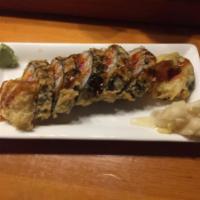 The Rock Roll · Tuna, salmon, hamachi, avocado deep fried. Served with masago and unagi sauce.