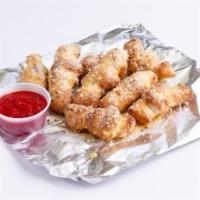 Breadstick Garlic Knots · Perfectly baked and sprinkled with a blend of garlic herbs and spices. served with a marinar...