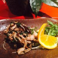 Japanese Mushrooms · Sauteed with spinach in light soy sauce and butter.