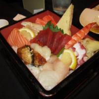 Chirashi Bowl · A traditional sushi dish in Japan. Assorted chef's choice sashimi over sushi rice. Served wi...