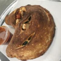Deluxe Calzone · Pepperoni, sausage, mushrooms, onions, bell peppers, black olives, basil, tomato sauce, rico...