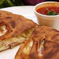 Cheese Calzone · Made with ricotta and Mozzarella cheese. Includes a side of marinara sauce.