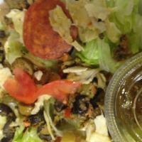 Italian Salad · Lettuce, artichoke, tomatoes, pepperoni, olive salad and jalapenos.