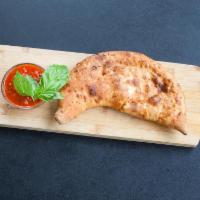 Gourmet Veggie Calzone · Artichoke hearts, olive, roasted eggplant, roasted peppers, and zucchini.