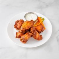 Heritage Wings · Your choice of wing sauce. Served with carrots, celery sticks and blue cheese dressing.