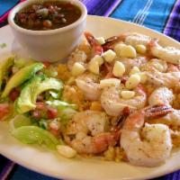 Shrimp Mojo De Ajo · Eight grilled shrimp served over buttered white rice and salad. 