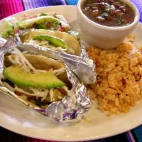 Fish Taco Plate · Two crispy fish tacos, rice and charro beans