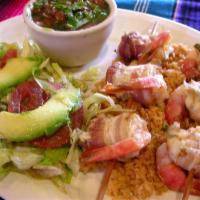 Shrimp Diablo · Shrimp skewers wrapped with bacon over rice and charro beans