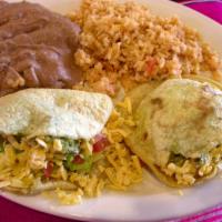 Gorditas · Two homemade corn tortillas filled with shredded chicken or fresh ground beef, lettuce, toma...