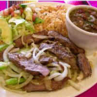 Fajita Dinner · Marinated chicken or beef fajita, onions and bell peppers. Served with rice, charro beans, p...