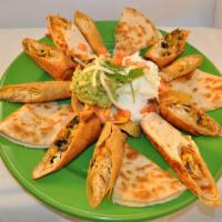 Super Sampler · A bed of chips topped with melted cheese, beans, sour cream and guacamole. Includes: quesadi...