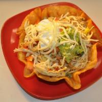 Taco Salad · Crispy flour tortilla bowl. Choice of beef, chicken or beef tips. Filled with beans, lettuce...