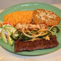 Carne Ala Tampiquena Steak · Tender skirt steak grilled to perfection, served with one cheese enchilada, lettuce, tomatoe...