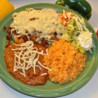 Pollo Toluca · Grilled chicken breast spiced up with homemade chorizo and cheese. Served with rice, beans, ...