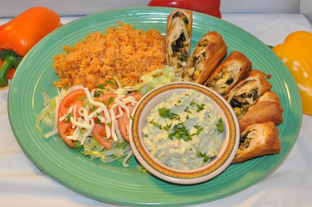 South West Chimichangas · 3 deep fried chimis cut in half, filled with diced grilled chicken, black beans, corn, spinach, onions, and cheese. Served with rice, lettuce, tomatoes and primo salsa. NO OPTIONS PREMADE