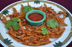 Onion Bhaji · Onion fritter seasoned with ginger and spices. Vegan.