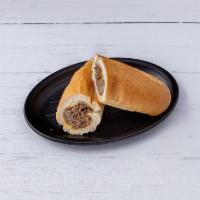 Philly Cheesesteak · Steak, cheese and caramelized onion sandwich. 